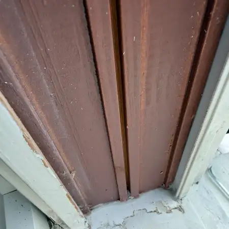 Weathered exterior window trim before repair